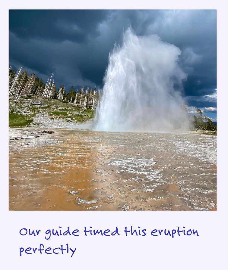 a polaroid image of an erupting geyser in Yellowstone.