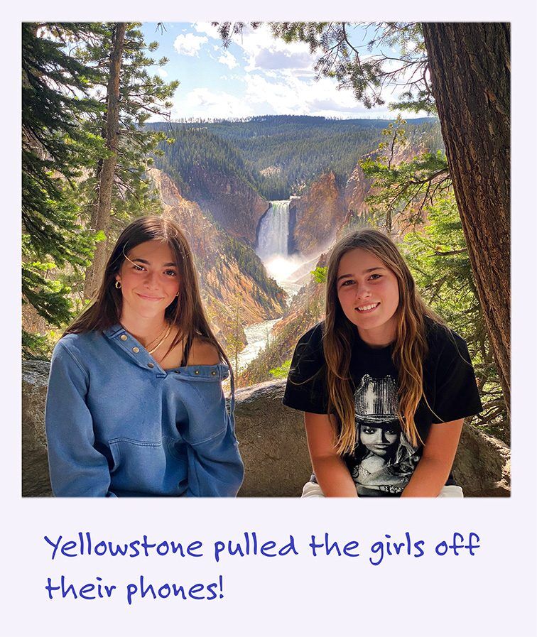a polaroid image of girls with a waterfall behind them in Yellowstone